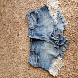 Fringe jean shorts with lace detail